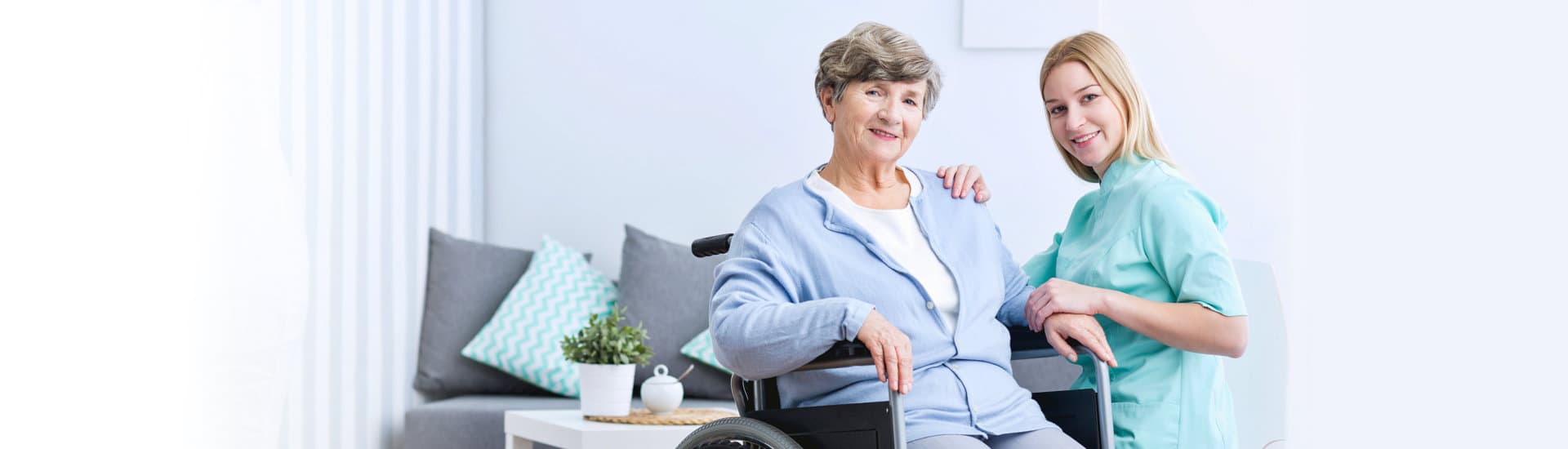 caregiver and elderly woman in a wheelchair